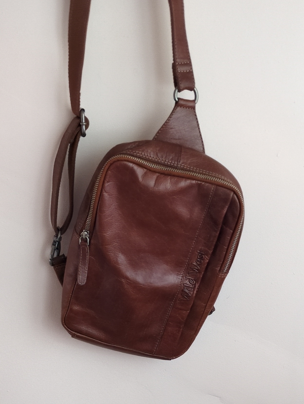 Brown leather Wild West Los Angeles crossbody sling bag, Green Plaid Interior.